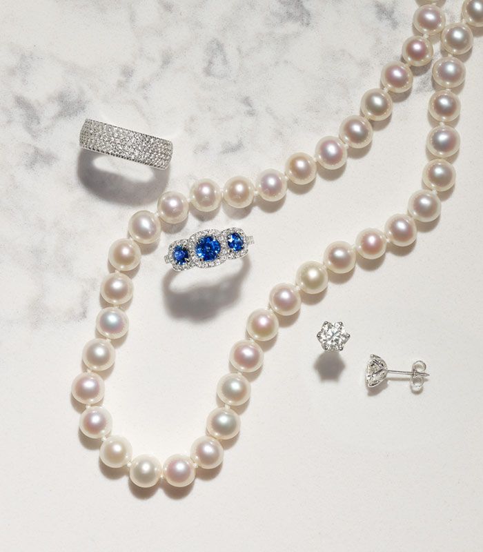 Mobile image of a Diamond Ring, Pearl Necklace, Sapphire Ring, and Diamond Earrings